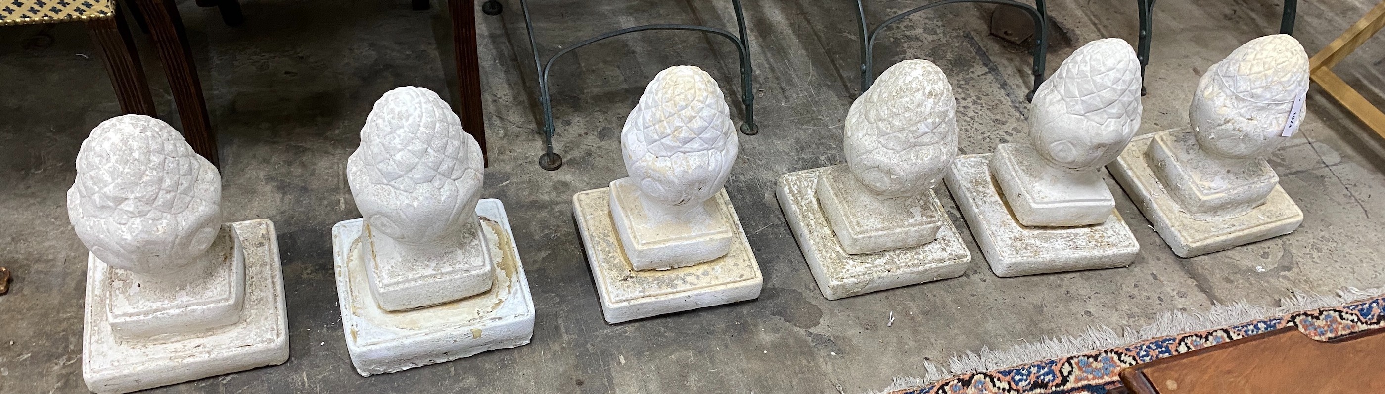 A set of six painted reconstituted stone garden acorn finials, height 36cm